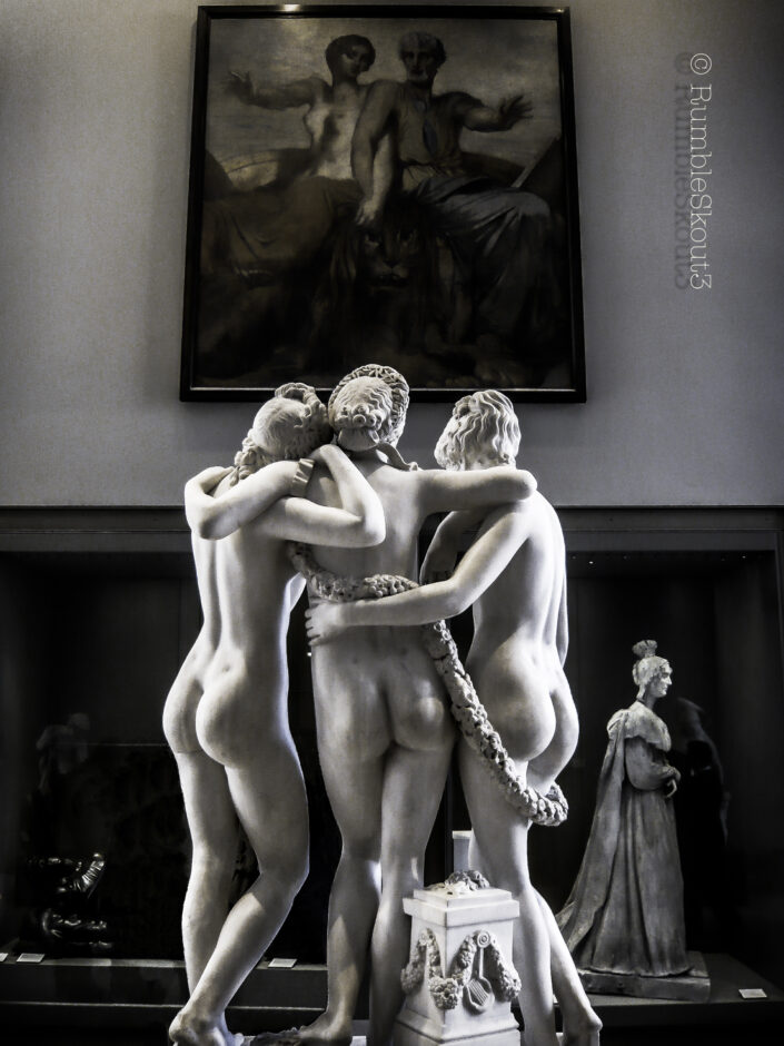 A stone woman sculpture of Les Trois Grâces by James Pradier (1831) at the Louvre Museum, 1st arrondissement of Paris (black and white). 3 Graces