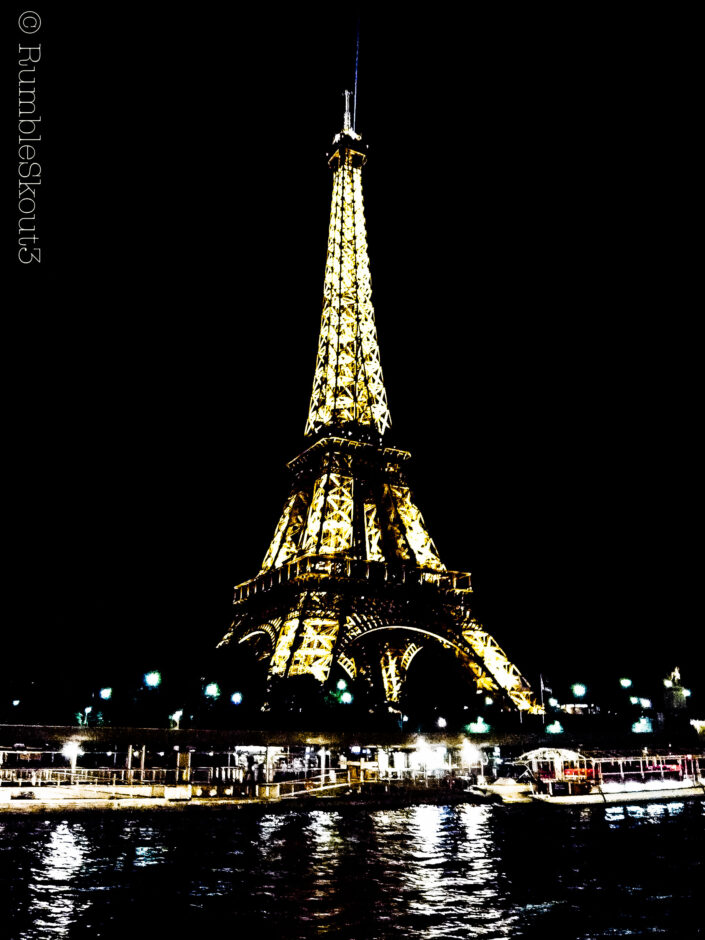 The Eiffel Tower at night, in all of its glow by the banks of the Seine river, invokes a noir feeling throughout the 7th Arrondissement.