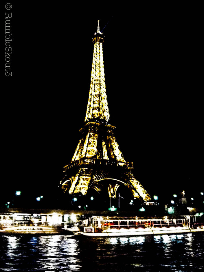 The Eiffel Tower at night, in all of its glow by the banks of the Seine river, invokes a noir feeling throughout the 7th Arrondissement.