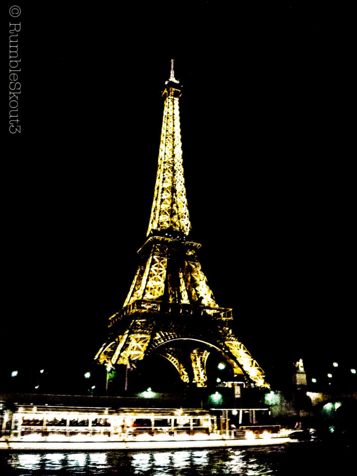 The Eiffel Tower at night, in all of its glow by the banks of the Seine river, invokes a noir feeling throughout the 7th Arrondissement.