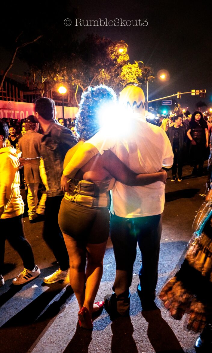 A flash into the secret lives of Homer & Marge, enjoying human attention at the Halloween Carnaval in West Hollywood. (the simpsons cosplay) (Los Angeles Street Photography)