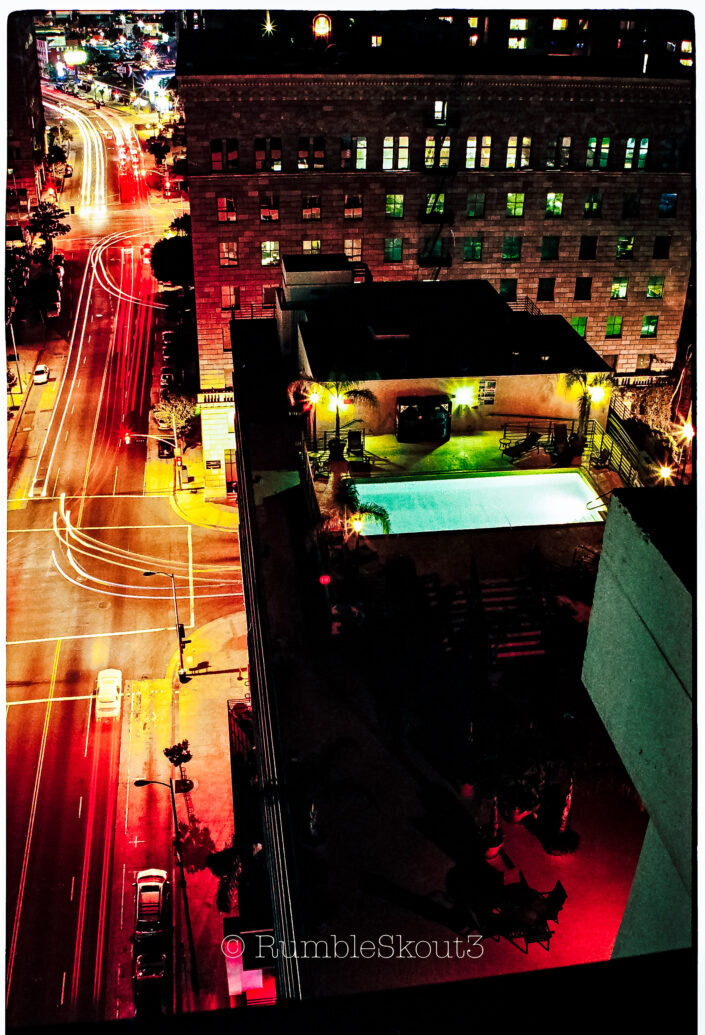 Suspended over Olympic Blvd and Hope St is a rooftop swimming pool @ Renaissance Tower in South Park, DTLA. (Los Angeles Street Photography) ( (Los Angeles) (night) (35mm) dtla