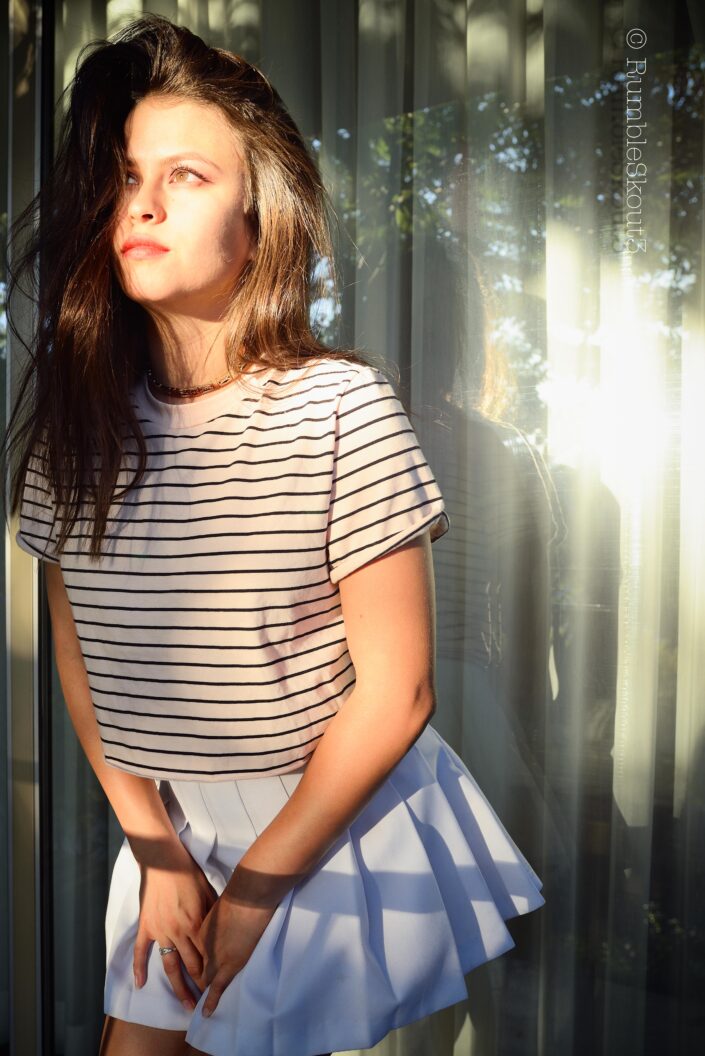 Meditación An Indigenous Mexican Nikon fine art Meditación in Natural Light Fashion Photography session of an aspiring Hilfiger Fashion Model in women's striped top and pleated tennis skirt with amber-eyes-American beauty fashion model.