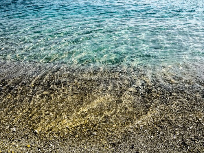 Golden sand and aqua colored water showcase the Greek Waters of the Mediterranean Sea @ Villefranche-sur-Mer, French Riviera, Côte d'Azur.