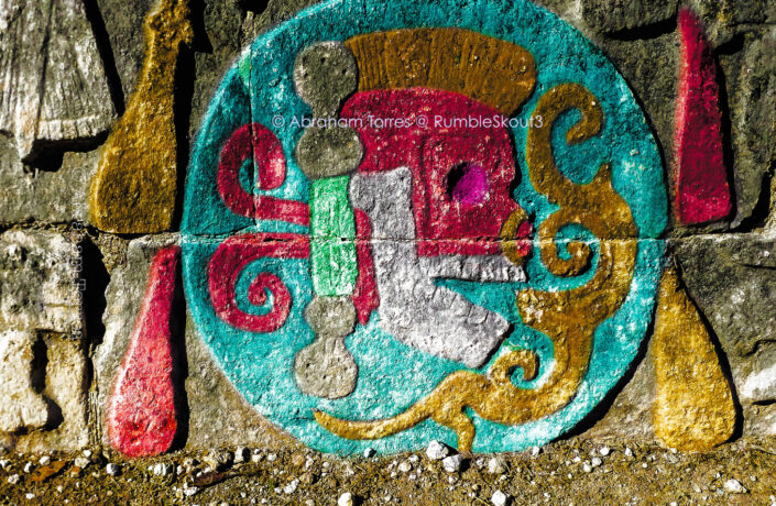 A color digital imagination of a Leica image, transformed using Photoshop and Lightroom to bring new life to a Maya skull relief found at the Great Ball court of Chichén Itzán. Casco Guerrero Maya de Colores México Fine Art Collection (The Great Ball Court side panels of Chichén Itzán) (UNESCO World Heritage Site) (maya skull relief) (carved stone) Yucatán Peninsula New Seven Wonders of the World (maya warrior headdress) digital darkroom reimagine Adobe Suite
